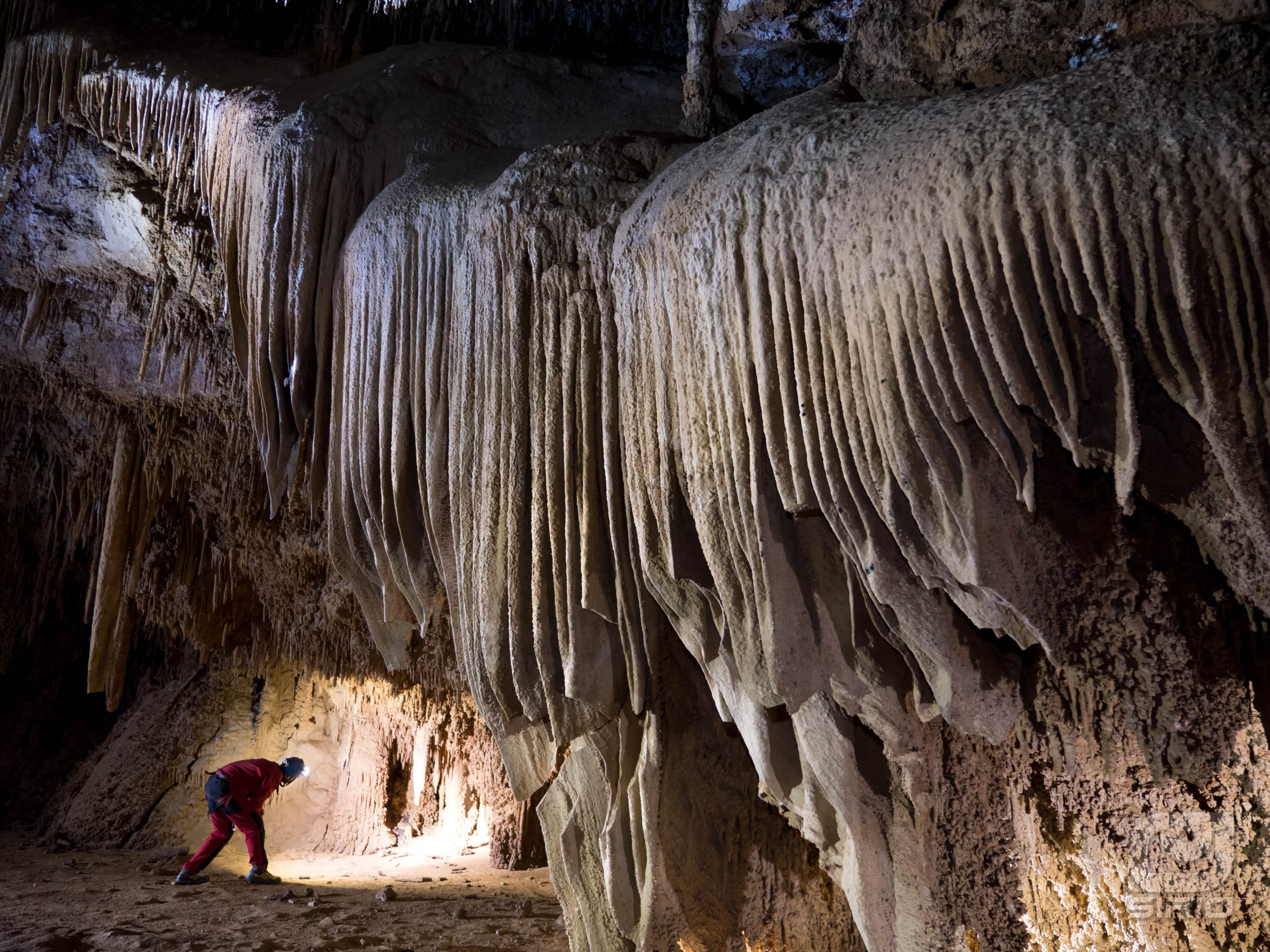 Caver looking for a hole