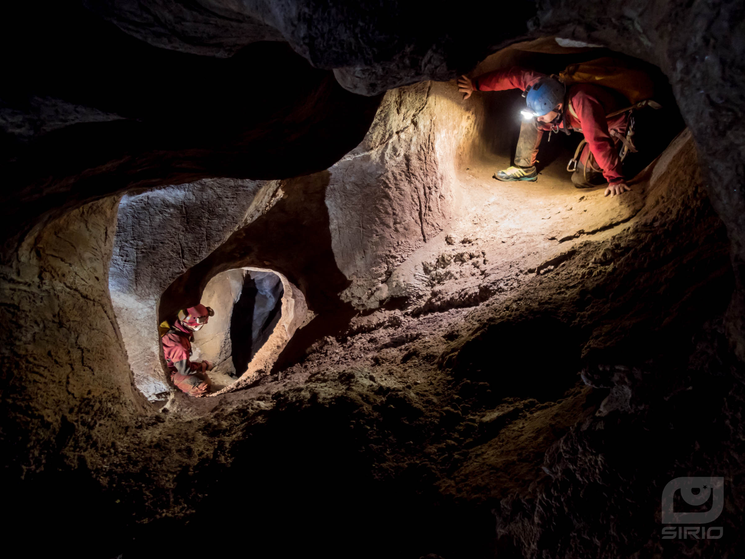 two cavers in a labyrinth